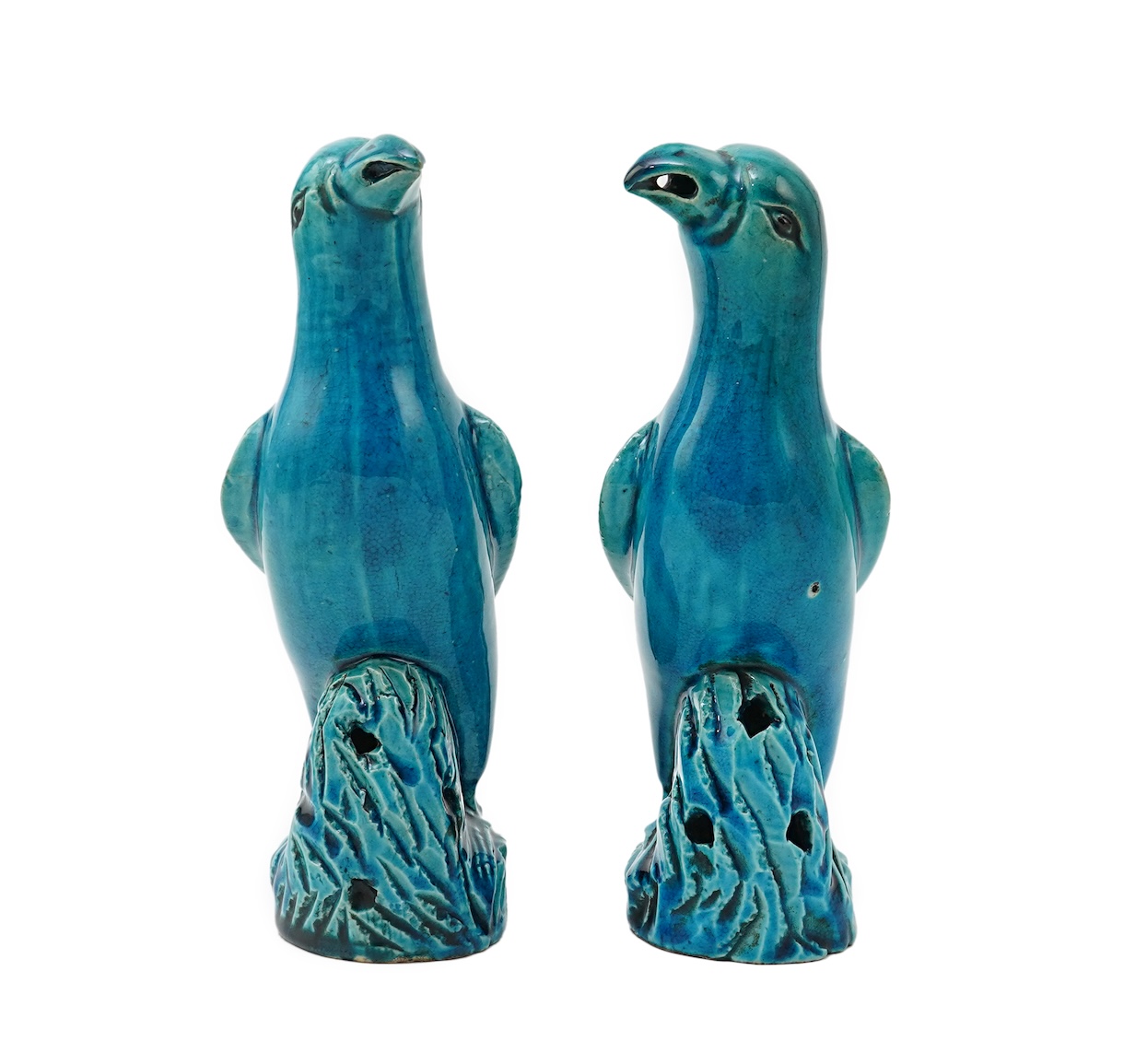 A pair of Chinese turquoise glazed models of parrots, 18th century